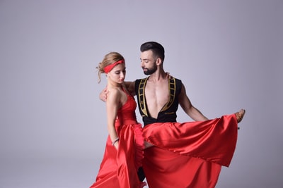 The woman in red dance clothes

